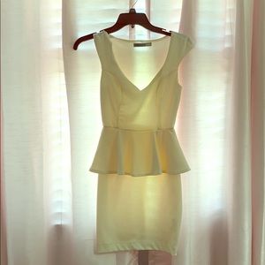 Cream-colored peplum dress